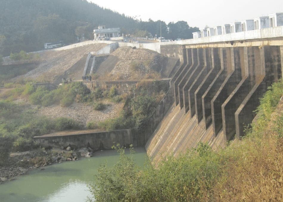 Kelaghagh Dam reservoir — calm water surrounded by sal and mixed forest, Simdega district, Jharkhand