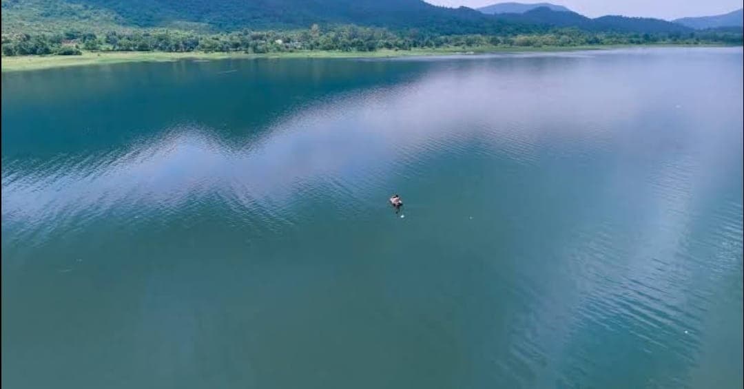 Malay Dam reservoir — forested hills reflected in still water near Latehar town, Latehar district, Jharkhand